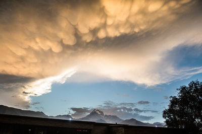 Low angle view of mountain against sky during sunset