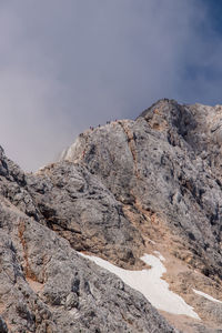 Low angle view of rock formations against sky