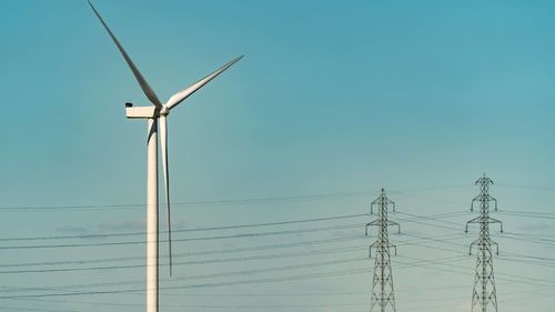 Low angle view of wind turbine against sky