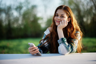 Young woman using mobile phone