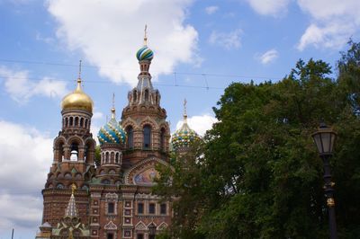 Low angle view of cathedral against cloudy sky