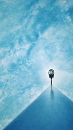 Low angle view of lamp post against blue sky