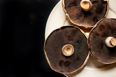 Close-up of mushrooms against black background