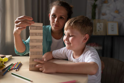 Mother and son playing game together