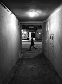 Woman walking in tunnel