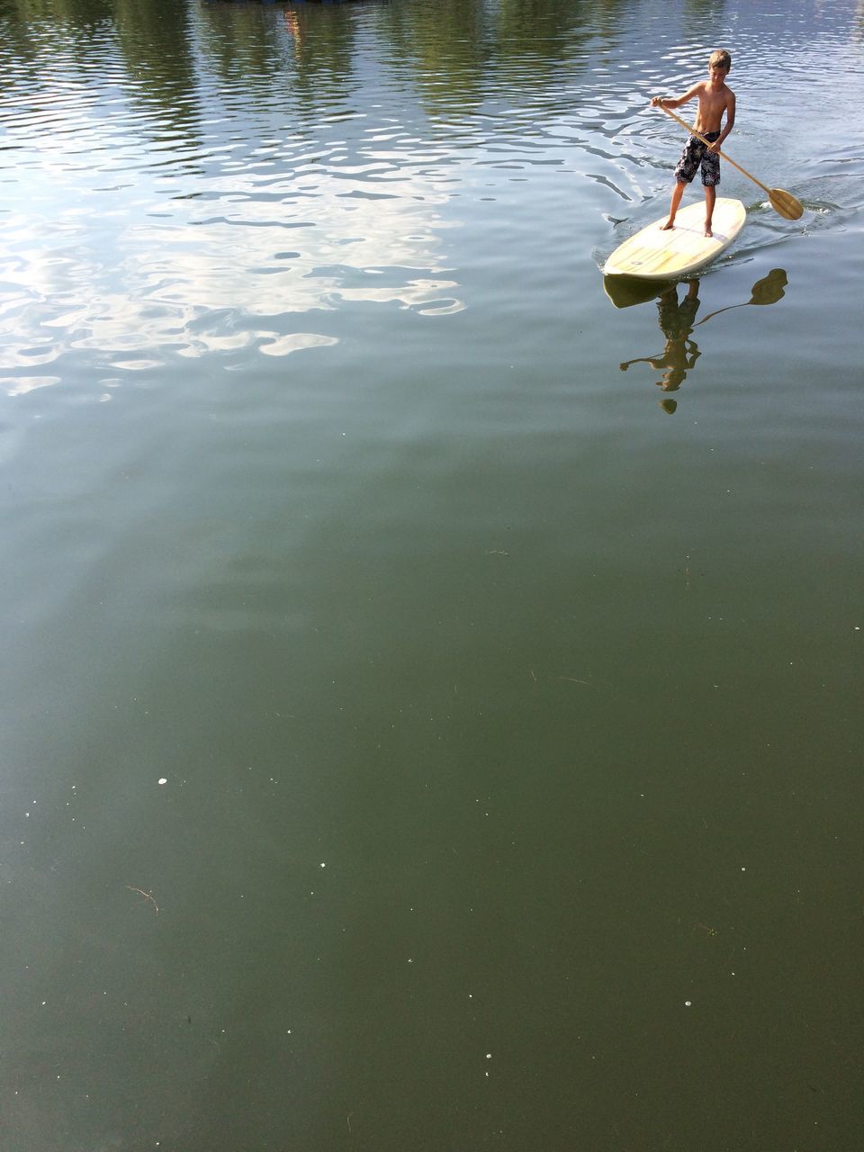 water, swimming, lake, waterfront, reflection, animal themes, high angle view, rippled, lifestyles, leisure activity, nature, duck, floating on water, men, animals in the wild, day, wildlife, outdoors