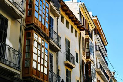 Low angle view of buildings against clear sky