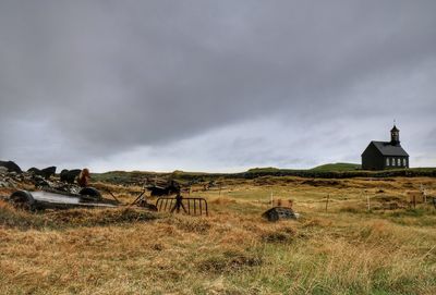 Scenic view of landscape against cloudy sky