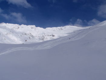 Scenic view of snow covered landscape against sky