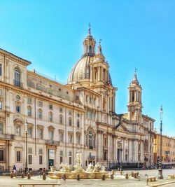 View of buildings in city against clear sky