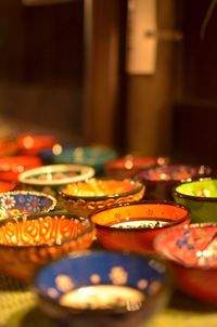 Close-up of colorful bowls on table for sale in store