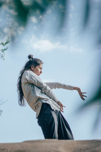 Woman dancing in forest