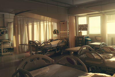 Empty chairs and table in room