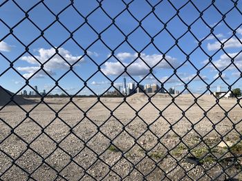 Field seen through chainlink fence