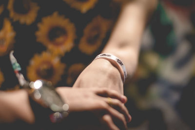 Close-up of people holding hands