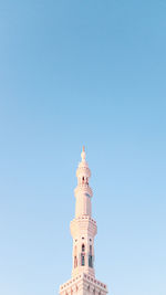 Low angle view of a building against blue sky