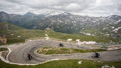 High angle view of people riding bicycle on winding road