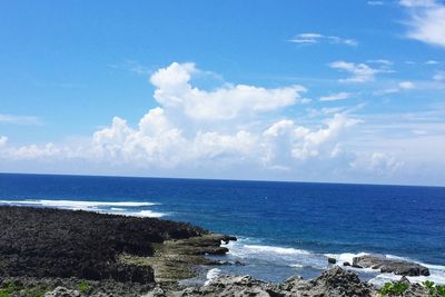 Scenic view of sea against cloudy sky