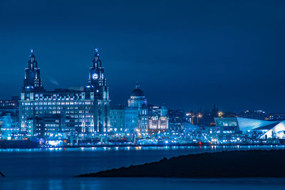 Illuminated buildings in city at night