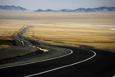 Scenic view of mountain road against sky