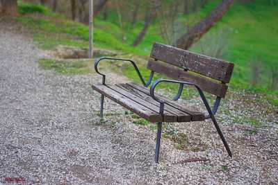 Empty bench on grassland