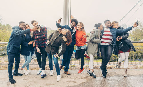 Multi-ethnic friends taking selfie