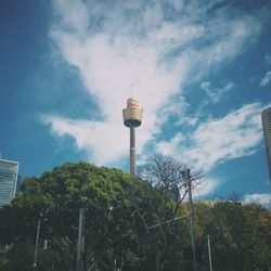 Low angle view of tower against cloudy sky