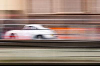 Blurred motion of car on road in city