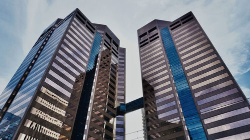 Low angle view of modern buildings against sky