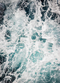 High angle view of waves splashing in sea