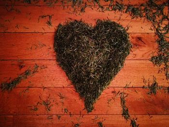 Close-up of heart shape on brick wall