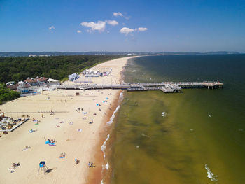 High angle view of crowd at beach against sky