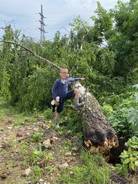 Full length of young man against plants and trees