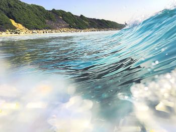 Bodysurfing a wave at swamis beach in encinitas, san diego, california