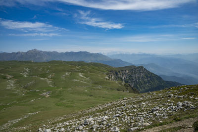 Scenic view of landscape and mountains against sky