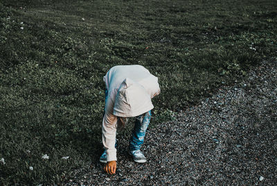 Rear view of man on field