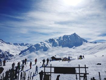 People on snowcapped mountain