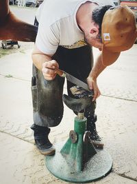 Full length of man working on fountain