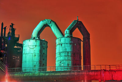 Low angle view of industrial units against clear sky