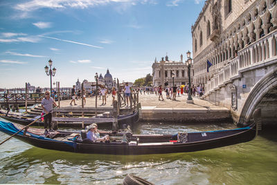 Group of people on boats in canal