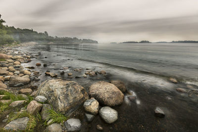 Scenic view of sea against cloudy sky