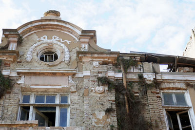 Low angle view of old building against sky