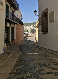 Footpath amidst buildings in town
