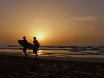 Scenic view of sea at sunset