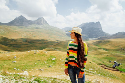 Woman standing on mountain