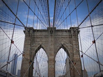 Low angle view of brooklyn bridge against sky