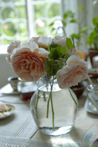 Close-up of rose in vase on table