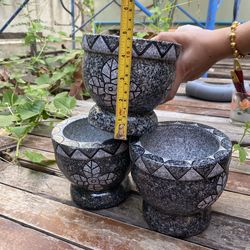 Close-up of person hand holding ice cream on table