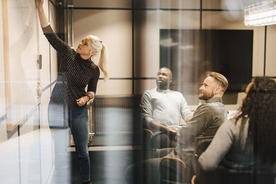 Coworkers having meeting in office