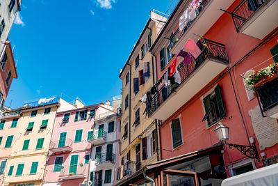 Low angle view of residential building against blue sky